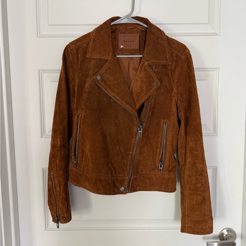 brown leather jacket with zipper details